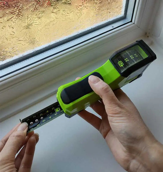preparing to measure a window reveal for fitting blinds